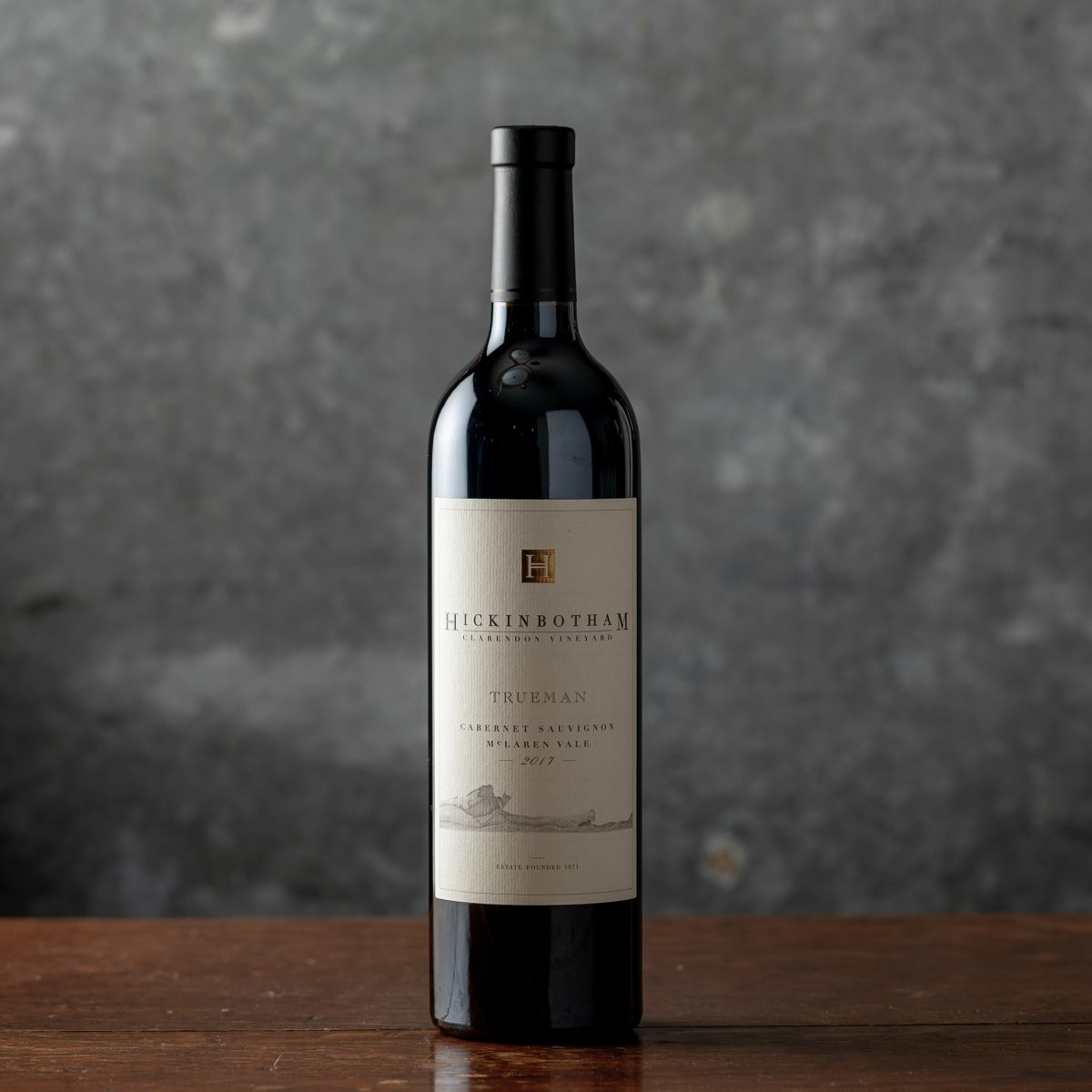 Wine bottle of Trueman Cabernet Sauvginon against a gray backdrop